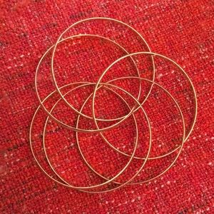 Gold tone linked bracelets.